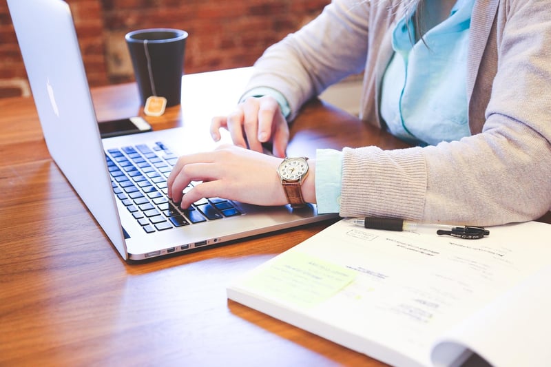 Writer Typing on Keyboard